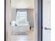 Bathroom featuring a standalone tub with marble tile at 10153 Gasparilla Rd, Placida, FL 33946