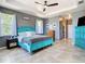 Spacious bedroom features tray ceilings and natural light from the large windows at 10153 Gasparilla Rd, Placida, FL 33946
