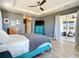 Open bedroom features large bed, TV, and large windows with natural light at 10153 Gasparilla Rd, Placida, FL 33946