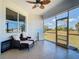 Outdoor lanai featuring comfortable seating and views of the backyard's landscaping at 10153 Gasparilla Rd, Placida, FL 33946