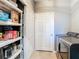 Laundry room area with washer, dryer, storage, and a tiled floor at 10153 Gasparilla Rd, Placida, FL 33946