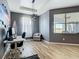 Bright office space with desk, chair, and natural light from the large window at 10153 Gasparilla Rd, Placida, FL 33946