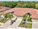 Aerial shot of property with well manicured landscaping and neutral paint at 11186 Batello Dr, Venice, FL 34292