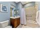 Well-lit bathroom with vanity, tub-shower combo, and neutral color palette at 11186 Batello Dr, Venice, FL 34292