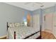 A serene bedroom with wood flooring, neutral walls, and multiple doors to other rooms at 11186 Batello Dr, Venice, FL 34292