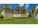 Venetian Falls community entrance featuring well-maintained landscaping and decorative signage at 11186 Batello Dr, Venice, FL 34292