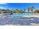 Relax in the community pool oasis featuring a spacious pool deck, perfect for a refreshing swim at 11186 Batello Dr, Venice, FL 34292