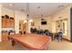 Game room featuring a pool table, card table, and comfortable seating at 11186 Batello Dr, Venice, FL 34292