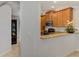 This home includes modern kitchen with granite countertops and stainless steel appliances at 11186 Batello Dr, Venice, FL 34292