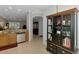 Open-concept kitchen with stainless steel appliances and view to formal dining and living spaces at 11186 Batello Dr, Venice, FL 34292
