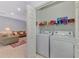 Functional laundry room with a full-size washer and dryer at 11186 Batello Dr, Venice, FL 34292