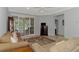This open living space offers comfortable seating and sliding glass doors to the outdoor area at 11186 Batello Dr, Venice, FL 34292