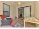 Relaxing screened-in patio with a ceiling fan and sliding door access at 11186 Batello Dr, Venice, FL 34292
