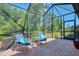 Inviting screened patio with comfortable seating for enjoying the outdoors at 11186 Batello Dr, Venice, FL 34292