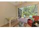 Serene screened-in patio features comfortable seating and views of lush greenery at 11186 Batello Dr, Venice, FL 34292