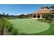 Enjoy the putting green, where neighbors enjoy outdoor fun at this immaculately kept course at 11186 Batello Dr, Venice, FL 34292