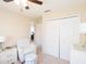 Bedroom with chair, ottoman and closet doors at 1124 W Hillsborough Blvd, North Port, FL 34288