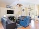 Open-concept living room featuring stylish furnishings, high ceilings and lots of natural light at 1124 W Hillsborough Blvd, North Port, FL 34288