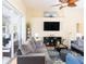 Bright living room with sliding glass doors, stylish decor and comfortable seating at 1124 W Hillsborough Blvd, North Port, FL 34288