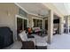Comfortable patio area with plush seating, ceiling fan, and elegant decorative touches at 1124 W Hillsborough Blvd, North Port, FL 34288