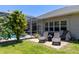 Inviting pool area with comfortable lounge chairs and an enclosed screened in lanai at 1124 W Hillsborough Blvd, North Port, FL 34288