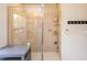 Modern glass-enclosed shower with tile surround and convenient shelving for toiletries at 1124 W Hillsborough Blvd, North Port, FL 34288