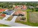 An aerial view shows the home's proximity to other houses in the neighborhood at 113 Mark Twain Ln, Rotonda West, FL 33947