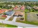 An aerial view shows the home's proximity to other houses in the neighborhood at 113 Mark Twain Ln, Rotonda West, FL 33947