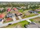 An aerial view shows the home's proximity to other houses in the neighborhood at 113 Mark Twain Ln, Rotonda West, FL 33947