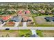An aerial view shows the home's proximity to other houses in the neighborhood at 113 Mark Twain Ln, Rotonda West, FL 33947