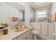 Accessible bathroom features a walk-in tub, vanity, and neutral color scheme for comfort and safety at 113 Mark Twain Ln, Rotonda West, FL 33947