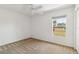 Bright bedroom featuring neutral carpet, window and ceiling fan at 113 Mark Twain Ln, Rotonda West, FL 33947