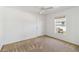 Bright bedroom with neutral carpet, a single window, and ample space at 113 Mark Twain Ln, Rotonda West, FL 33947