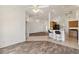 Spacious living room with a combined tiled and wood-look floors and lots of natural light at 113 Mark Twain Ln, Rotonda West, FL 33947