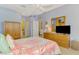 Bedroom featuring light blue walls and light-colored wooden dresser at 11437 Dancing River Dr, Venice, FL 34292