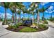 Wellen Park Downtown community entrance featuring lush landscaping, signage, and park benches at 11437 Dancing River Dr, Venice, FL 34292