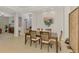Bright dining room with tile flooring, decorative art, and modern furnishings at 11437 Dancing River Dr, Venice, FL 34292