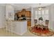 Eat-in kitchen with breakfast bar, modern appliances, and a cozy dining area perfect for casual meals at 11437 Dancing River Dr, Venice, FL 34292