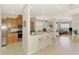 Bright, eat-in kitchen with a breakfast bar, modern appliances, and an open layout connecting to the living area at 11437 Dancing River Dr, Venice, FL 34292