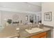 Kitchen bar showcases the open concept living area, great for entertaining guests at 11437 Dancing River Dr, Venice, FL 34292