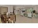 Open-concept living space with an adjacent kitchen, dining area, and an abundance of natural light for a bright and airy feel at 11437 Dancing River Dr, Venice, FL 34292