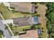 An aerial view of the roof and backyard featuring a screened pool and spa at 11455 Fort Lauderdale Pl, Venice, FL 34293