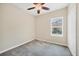 Comfortable bedroom with carpet, ceiling fan, and a window providing natural light at 11455 Fort Lauderdale Pl, Venice, FL 34293