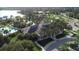 Aerial view of clubhouse, pool, and lounging area and a beautiful lake with a water slide for  at 11455 Fort Lauderdale Pl, Venice, FL 34293