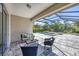 Enclosed patio area with outdoor seating and a view of the screened pool at 11455 Fort Lauderdale Pl, Venice, FL 34293