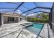 A screened in pool and spa are adjacent to the home and patio at 11455 Fort Lauderdale Pl, Venice, FL 34293