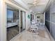 Spacious balcony with comfortable seating, ceiling fans, and views of the ocean at 1150 Tarpon Center Dr # 3G 307, Venice, FL 34285