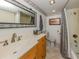 Bathroom featuring a wide mirror, vanity sink, and shower with patterned curtain at 1150 Tarpon Center Dr # 3G 307, Venice, FL 34285