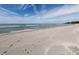 A wide sandy beach fronting calm water and a clear sky provide a tranquil setting at 1150 Tarpon Center Dr # 3G 307, Venice, FL 34285