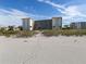 Beachside condominium building featuring multiple floors and balcony views for residents at 1150 Tarpon Center Dr # 3G 307, Venice, FL 34285